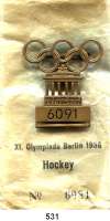 M E D A I L L E N,Olympiade Berlin 1936Teilnehmerabzeichen Nr.6091 (Bronze)  42 x 46 mm.  Ohne Band. Sowie Originaltüte mit Text 