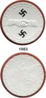 MEDAILLEN AUS PORZELLAN,Staatliche Porzellan-Manufaktur MEISSEN München 1939 weiß.  Besetzung der Tschecho-Slowakei.  Rand rot  und die beiden Hakenkreuze schwarz.